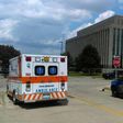 An ambulance is seen outside the Berrien County Courthouse in St. Joseph, Michigan, U.S., where a gunman opened fire killing two bailiffs and injuring a civilian and a sheriff's deputy before being shot dead, July 11, 2016.
