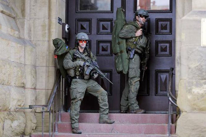 Police officers at the Canadian Parliament after a soldier was shot near the building in Ottawa on October 22, 2014. The parliament is now on lock down