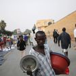 A man sells pots at a marketplace in Burundi's capital Bujumbura, as the country awaits the results of Tuesday's presidential elections, July 23, 2015. REUTERS/Mike Hutchings