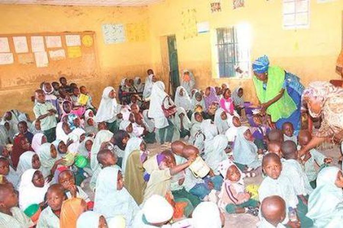 Primary school pupils being served food