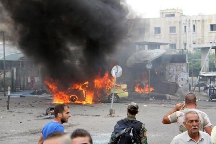 Blasts kill more than 100 in Syrian government stronghold
