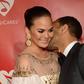 John Legend kissing his wife