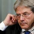 Italian Foreign Minister Paolo Gentiloni adjusts his headphones during a joint news conference with his Russian counterpart Sergei Lavrov following their meeting in Moscow, Russia, March 25, 2016.