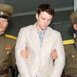 Otto Warmbier, being escorted by North Korean military officers