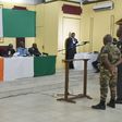 Two Ivorian soldiers who worked alongside jihadists who helped to organize the attack on the resort of Grand Bassam in March 2016 and who are accused of "violation of military rules" are questioned at the beginning of their trial on August 4, 2016 