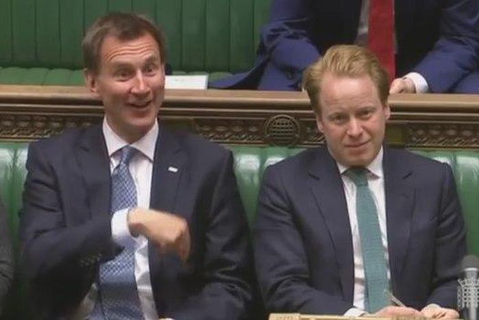 British MPs told off for "fiddling" with phones in parliament