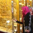 Women look at jewellery at a shop in a gold market in Basra, southeast of Baghdad February 14, 2015.