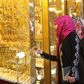 Women look at jewellery at a shop in a gold market in Basra, southeast of Baghdad February 14, 2015.