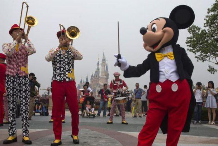 Mickey Mouse entertains visitors on the opening day of the Disney Resort in Shanghai, China.