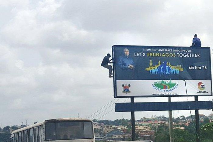 Edo people spotted relaxing on billboard after a long flight