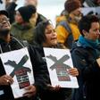 Demonstrators protest against the decision by public broadcaster the South African Broadcasting Corporation (SABC) that it would not broadcast scenes of violent protest, in Cape Town, South Africa, July 1, 2016.