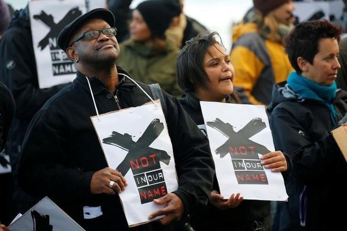 Demonstrators protest against the decision by public broadcaster the South African Broadcasting Corporation (SABC) that it would not broadcast scenes of violent protest, in Cape Town, South Africa, July 1, 2016.