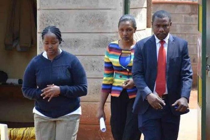 The suspect, Ann Mbaith (Left) being led to a court