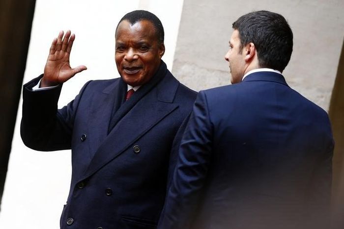 Congo's President Denis Sassou Nguesso waves as he arrives to attend a meeting with Italy's Prime Minister Matteo Renzi at Chigi Palace in Rome February 26, 2015. REUTERS/Tony Gentile/Files