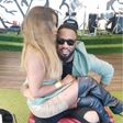 Nomakula Roberts sitting on Praiz' laps