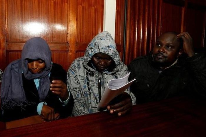 Kenyan police officers Silvia Wanjohi, Stephen Morogo and Fredrick Leliman, suspected of killing human rights lawyer Willie Kimani, his client and their driver, sit in the dock at Milimani Law courts in Nairobi, Kenya, July 4, 2016. Picture taken July ...