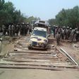 Nigerian troops are pictured in 2015 crossing a reconstructed bridge, previously destroyed by militants, in the northeastern town of Damasak 
