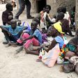 Residents displaced due to the recent fighting between government and rebel forces in the Upper Nile capital Malakal wait at a World Food Program (WFP) outpost where thousands have taken shelter in Kuernyang Payam, South Sudan May 2, 2015. REUTERS/Deni...