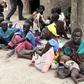 Residents displaced due to the recent fighting between government and rebel forces in the Upper Nile capital Malakal wait at a World Food Program (WFP) outpost where thousands have taken shelter in Kuernyang Payam, South Sudan May 2, 2015. REUTERS/Deni...