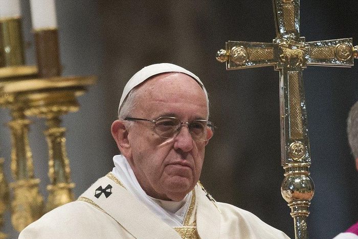 Pope Francis holding a cross