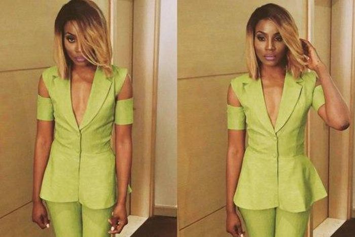 Seyi Shay in a green jumpsuit