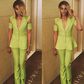 Seyi Shay in a green jumpsuit