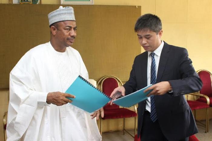 L-R: Secretary to Sokoto State Government (SSG), Professor Bashir Garba, exchanging signed documents with the Assistant Managing Director for Overseas Business of Kunming Engineering Corporation, Qui Haisheng, after the signing of MoU in Sokoto.