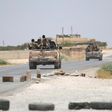 Syria Democratic Forces (SDF) ride vehicles along a road near Manbij, in Aleppo Governorate, Syria, June 25, 2016.