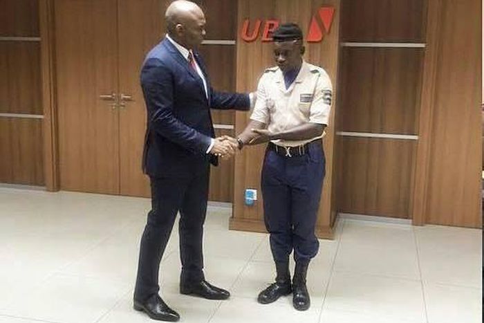 Tony Elumelu and security guard