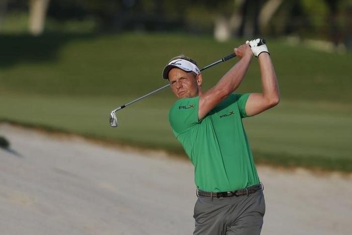 PGA golfer Luke Donald hits out of the sand on the 18th hole during the third round of the Sony Open in Hawaii golf tournament at Waialae Country Club. Jan 16, 2016; Honolulu, HI, USA;