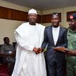 Daniel Oluwatobi flanked on both side by Prof. Mahmood Yakubu and Brigadier Gen Sule Kazaure