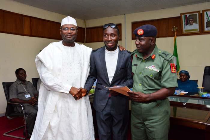 Daniel Oluwatobi flanked on both side by Prof. Mahmood Yakubu and Brigadier Gen Sule Kazaure