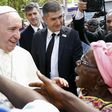 Pope Francis talks with a woman as he visits the refugee camp of Saint Sauveur in the capital Bangui, Central African Republic, November 29, 2015. REUTERS/Stefano Rellandini