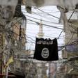 An Islamic State flag hangs amid electric wires over a street in Ain al-Hilweh Palestinian refugee camp, near the port-city of Sidon, southern Lebanon January 19, 2016.