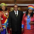 South African President Jacob Zuma poses for photographs with his three wives Sizakele Khumalo (R), Nompumelelo Ntuli (L) and Thobeka Mabhija after delivering his state-of-the-nation address in parliament in Cape Town.