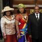South African President Jacob Zuma poses for photographs with his three wives Sizakele Khumalo (R), Nompumelelo Ntuli (L) and Thobeka Mabhija after delivering his state-of-the-nation address in parliament in Cape Town.