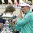 Jun 12, 2016; Sammamish, WA, USA; Brooke Henderson reacts after receiving the KPMG Women's PGA Championship trophy after a one-hole sudden death playoff against Lydia Ko (not pictured) during the final round at Sahalee Country Club - South/North Course...