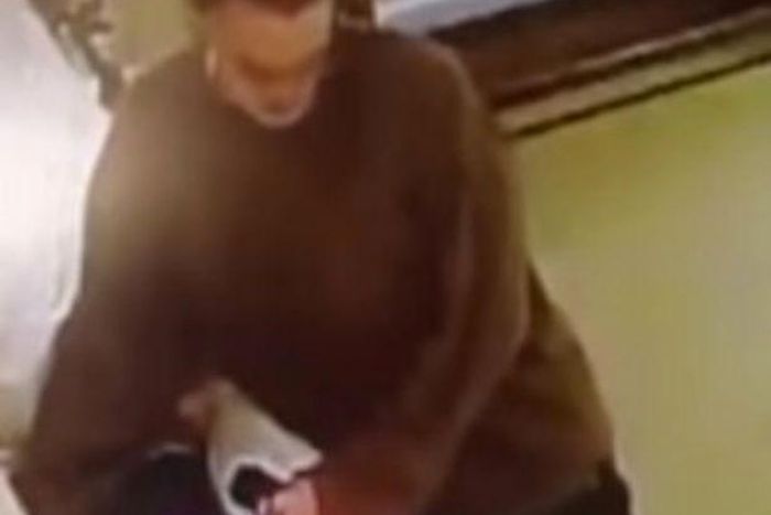 Unidentified woman caught on camera stealing ring off dead body