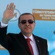Turkish President Tayyip Erdogan waves to supporters during an inauguration ceremony of a water pipeline project linking Turkey to northern Cyprus, in Myrtoy October 17, 2015. REUTERS/Yiannis Kourtoglou