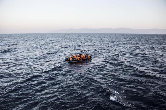 An inflatable boat full of refugees