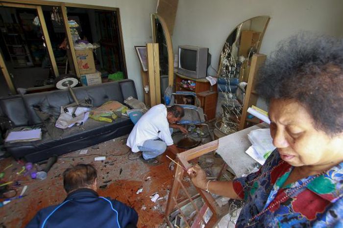 One dead, dozens wounded in wave of bombs in south Thailand