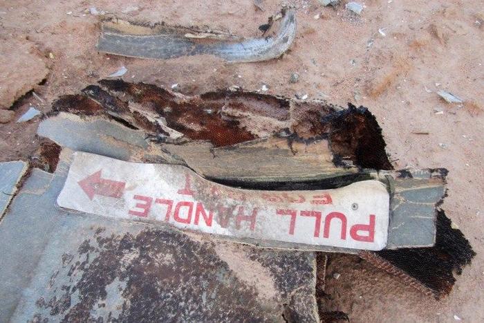 Debris is seen at the crash site of Air Algerie flight AH5017 near the northern Mali town of Gossi, July 24, 2014.  REUTERS/Burkina Faso Military/Handout via Reuters