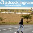A man runs past the Adcock Ingram offices in Johannesburg December 3, 2013.