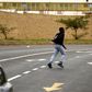 A man runs past the Adcock Ingram offices in Johannesburg December 3, 2013.