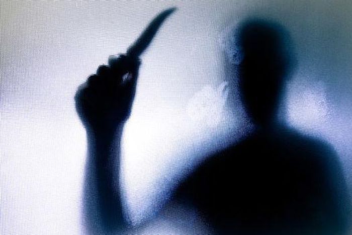 The corpse of a woman is found in a sitting position after it had been stabbed a number of times. - Daily Express