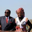 Zimbabwe's President Robert Mugabe and his wife Grace greet supporters of his ZANU (PF) party during the "One Million Man March", a show of support of Mugabe's rule in Harare, Zimbabwe, May 25, 2016.