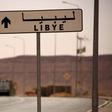 A road sign shows the direction of Libya near the border crossing at Dhiba, Tunisia April 11, 2016.