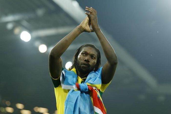 Norwich's Dieumerci Mbokani applauds the fans at the end of the match after being relegated from the Barclays Premier League