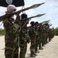 Al Shabaab militants parade new recruits after arriving in Mogadishufrom their training camp south of the capital in this October 21, 2010 file photo. REUTERS/Feisal Omar/Files