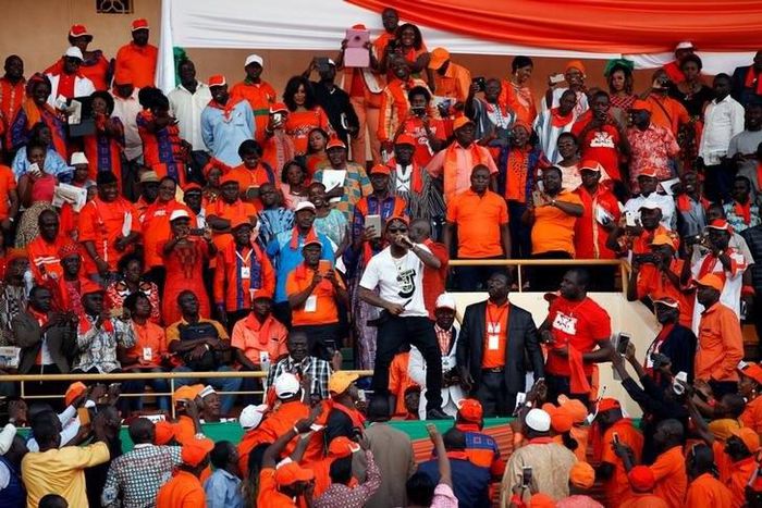 Nigerian pop star Davido (C) performs during the last campaign rally of presidential candidate Roch Marc Kabore in Ouagadougou, Burkina Faso, November 27, 2015.